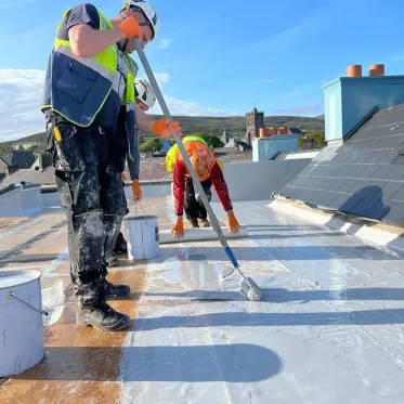 Men applying Lava 20 on roof